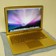 Illustration for article titled Gold MacBook Air Has Bejeweled Rainbow Apple
